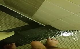 Two guys jerking off in the gym shower