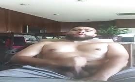 Bearded latino dude wanking his fat cock