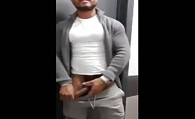 Horny funny face latino guy stroking his cock