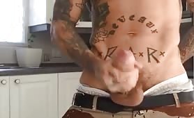 Tattooed thug shooting a huge load in the kitchen