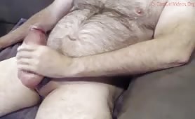 Hairy bear enjoys touching his fat curved cock