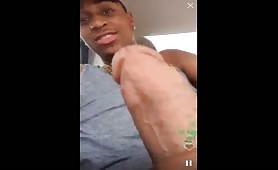 Black thug stroking his cock in the car