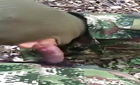 Soldier in the bushes sucking a huge cock from his straight partner