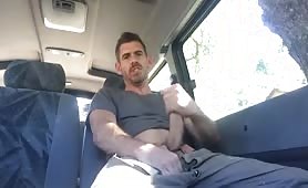 Cute horny stud jerks off in a van