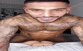Verbal muscular tattooed stud playing with his ass toy