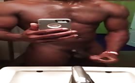 muscular black dude masturbating in the bathroom gym
